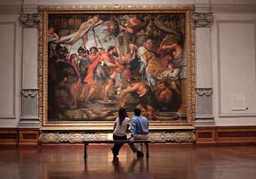 Photo of a couple looking at a painting. Links to Tangible Personal Property Photo of a couple looking at a painting. Links to Tangible Personal Property